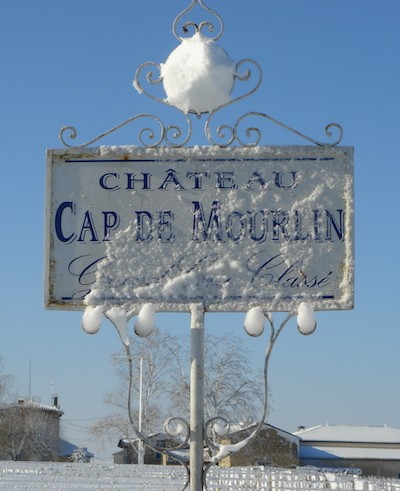 Château Cap de Mourlin under the snow panel in the middle of the vineyards  